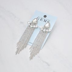 Sparkle in style with these J'adore -Clearncluster rhinestone dangle earrings, featuring a stunning clear rhinestones set on silver. Measuring 4" in length and 1" in width, these earrings are perfect for a fitness competitor looking for a versatile accessory. The stainless steel hypoallergenic post ensures comfort and security, while the cubic zirconia cluster vine fringe design adds a touch of elegance and glamour. Get ready to turn heads and feel confident with these must-have earrings! Rhinestone Bracelet, All That Glitters, Silver Rhinestone, Rhinestone Earrings, Clear Rhinestones, Bracelet Sizes, Feel Confident, Clear Crystal, Crystal Rhinestone