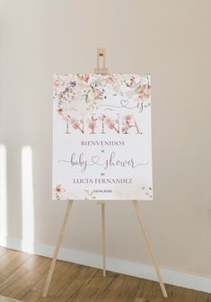 an easel with a sign on it that says nina, baby shower and lucia fernandizza