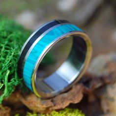 A fortified union, embodied in titanium. This striking ring blends onyx and Chrysocolla Stone for a modern look that stands the test of time. Durable and bold, yet lightweight enough to wear every day—the perfect symbol of everlasting love. Titanium Wedding Rings, Titanium Rings, Everlasting Love, Onyx Stone, The Test, Wedding Ring, Onyx, Every Day, Wedding Rings