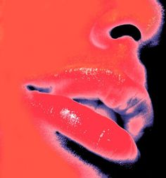 a woman's lips are shown in pink and orange