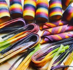 several different colored objects are arranged on a cutting board and laid out to look like they have been dyed