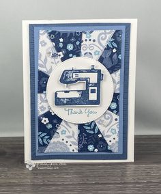 a blue and white thank card with a sewing machine on the front that says thank you