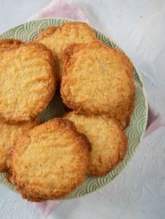 four cookies on a green and white plate