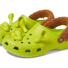 Step Into Fun Style With Crocs Shrek Classic Clog. Incredibly Light And Fun To Wear. Water-Friendly And Buoyant; Weighs Only Ounces. Ventilation Ports Add Breathability And Help Shed Water And Debris. Easy To Clean And Quick To Dry. Pivoting Heel Straps For A More Secure Fit. Customizable With Jibbitz Charms. Iconic Crocs Comfort. 100% Thermoplastic Construction.