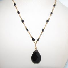 16.75" Black Agate And Onyx Necklace With Gold Filled Wire Wrapped Chain This Particular Piece Is Approximately 16.75" And Features A Toggle Clasp. The Faceted, Tear-Shaped, Polished Pendant Is Onyx And Drops Approximately 1.25" Below The Base Of The Necklace. The Faceted, Oval-Shaped Stones Are Black Agate And Are Delicately Intertwined Into The Handmade Chain Alongside Gold-Filled Beads To Add To The Richness And Elegance Of The Necklace. Black And Gold Are Timeless Colors In Jewelry But They Are Certainly Perfect Colors For Winter And Evening Gown Season. Each Stone And Bead Are Hand-Wrapped Into The Chain By A Labor Intensive Process Called Wire-Wrapping. This Is Different Than Simple Wire Wrapped Chain, Handmade Chain, Black Onyx Necklace, Bohemian Art, Dangle Necklaces, Onyx Necklace, Black Agate, Black Necklace, Necklace Black