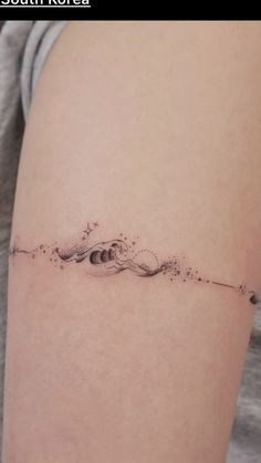 Unique & Cute Travel Tattoo Ideas For Women Collarbone Tattoo Wave, Ocean Finger Tattoos For Women, Wave Anklet Tattoo, Ocean Finger Tattoo, Wave Small Tattoo, Wave Tattoo Shoulder, Water Tattoo Ideas Ocean, Travel Tattoo Ideas For Women, Wave Tattoo Foot