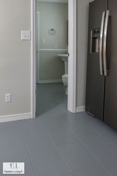 an open door leading to a bathroom with a toilet