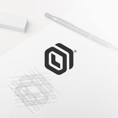 a pen and paper with the letter o on it