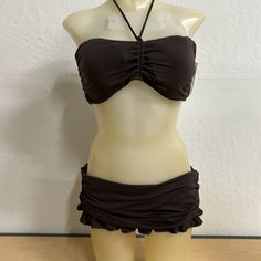 Juicy Couture Ruffled Skirted Bikini Brown Size Xl Nwt Make A Stylish Statement At The Beach With This Two-Piece Juicy Couture Bikini Swimsuit In Brown The Halter-Style Top Features Removable Pads And Logo J Charms On Tie Ends, While The Swim Skirt Bottom Provides A Comfortable Fit And Coverage. The Back Has No Ties Or Hooks In The Middle Back The Solid Pattern And Sleek Brown Silhouette Make It A Timeless Choice For Any Pool Or Beach Day. Note: Small Snag Hole See Last Photo Easily Repairable N Logo J, Shipping Label, Swim Skirt, Solid Pattern, Halter Style, Retail Store, Beach Day, Juicy Couture, At The Beach