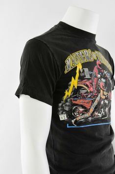 "Black double-sided graphic tee shirt. Front with Masters of Thunder # 1 series &2 motorcycle racers. Back of tee has Andrea's Harley Davidson Urbana, IL. 1992copyright date. Great pre-owned vintage, however, there is a hole in the left underarm about 1/2\" long. Vintage Tag Size: M 38-40 Material: cotton Closure: Pullover Chest: 38\" Length: 28\" -------------------------------------------------------------------------------- Gender: Men Modified Item: No Country/Region of Manufacture: Unit Motorcycle Racers, Mom Jeans Shorts, Graphic Tee Shirt, High Rise Mom Jeans, Floral Print Skirt, High Waisted Shorts Denim, Graphic Tee Shirts, 90s Vintage, High Waisted Denim