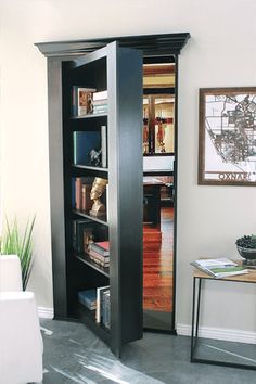 an open book case in the corner of a living room