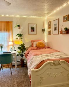 a bed room with a neatly made bed and desk