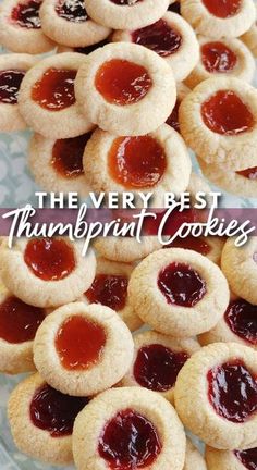 there are many small cookies with jam on them and the words, the very best thumbprint cookies