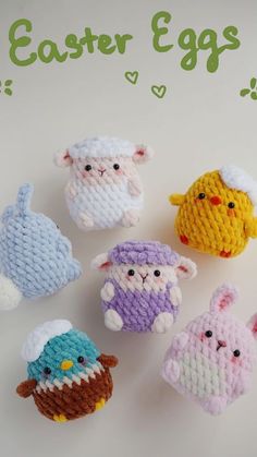 small crocheted animals sitting on top of a white table next to each other