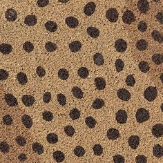 an animal skin with black spots on it