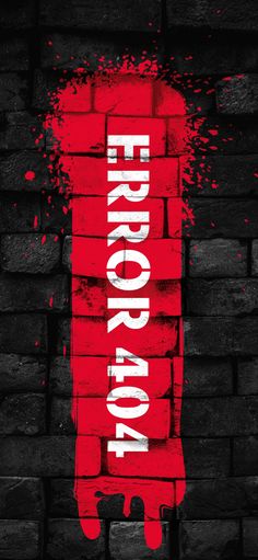 a brick wall with the word error painted on it in white and red paint splatters