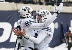 two football players congratulate each other on the field