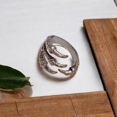 This striking Raven Claw Talon Wrap Ring is expertly handcrafted from steinless steel, delivering both timeless style and durability. 🖤 Each Ring is handmade, so every piece has slight variations, making each one truly one-of-a-kind. Please note that colors may vary slightly from the photos due to different display settings.  Each ring is hand-cast with meticulous attention to detail, showcasing the fierce and intricate design of a raven's talon, symbolizing power, mystery, and transformation. Gothic Viking, Raven Claw, Wrap Ring, Viking Jewelry, Hand Cast, Wrap Rings, Rings Statement, Statement Jewelry, Solid 925 Sterling Silver