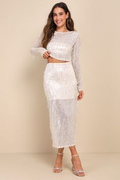 If you want to guarantee the maximum amount of compliments, then you'll definitely want to show up wearing the Lulus Greatest Sparkle Beige Mesh Sequin Fringe Two-Piece Midi Dress! Shiny silver sequins create a fringe-like effect across sheer beige mesh as it shapes this stunner of a dress, that starts with a fitted crop top with a crew neckline and long sleeves. The matching skirt features a flattering high-rise fit and a figure-skimming silhouette that finishes at a modern midi hem. Hidden sid Glamorous Fitted Two-piece Party Dress, Fitted White Two-piece Dress For Party, Fitted Long Sleeve Two-piece Dress For Party, Sequin Fringe Dress, Bridal Wardrobe, Fitted Crop Top, Bachelorette Party Outfit, Lulu Fashion, Adhesive Bra