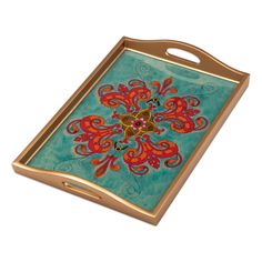 a blue and red tray with an ornate design on it