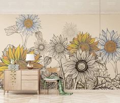 an artistic wall mural with sunflowers painted on the walls and in front of a dresser