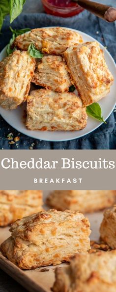 cheddar biscuits on a plate with basil leaves in the background and text overlay reading cheddar biscuits breakfast