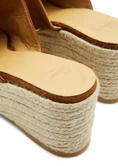 Info & Care:.Castañer suede espadrille mules.Wedge heel measures approximately 3 inches/ 70mm.Contrast stitching, rubber sole, open almond toe.Slip-on.Size & Fit:.Only available in full sizes, go up to the nearest whole size if you take a half size.This style may not be suitable for wide feet.Displayable Product Name: Eleo suede wedge espadrille mules.Style Number: 997304.Merret Style Number: 997304.Department Description: CONTEMPORARY SHOES.Department Number: 141.Visible In Search: true.Slug: New Season.Season: AW24.Supplier Brand: CASTANER.Family Of Business: 006.Runs To Size: This style runs true to size.Restricted Delivery UK: false.Restricted Delivery Europe Exc Ireland: false.Restricted Delivery Ireland: false.Restricted Delivery America: false.Restricted Delivery Asia Exc Hong Kong: Contemporary Shoes, Holiday Heels, Wedge Mules, Beauty Foods, Suede Wedges, Go Up, Wedge Espadrille, Beauty Gift, Corporate Gifts