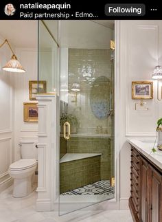 a bathroom with a walk in shower next to a toilet