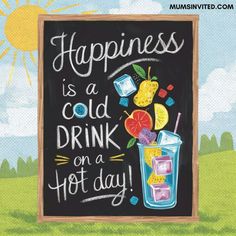 a chalkboard sign that says happiness is a cold drink on a hot day with fruit and ice