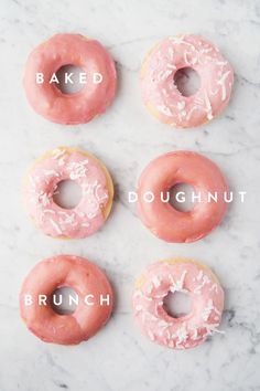 four doughnuts with pink icing and white sprinkles