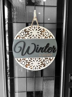 16" Wooden "Winter is Supid" door hanger, funny winter decor.  Classy and elegant, yet downright hilarious.  **Perfect for   - Your home entrance   - Seasonal décor   - A playful gift for friends who feel the same way!   **Crafted with care**   This 16" wooden door hanger adds a touch of humor and personality to your home.  It is laser cut and engraved on 1/4" wood, hand painted, assembled, and finished with a rope for hanging. Wooden Christmas Decor, Funny Door Signs, Ornament Party, Wooden Door Hanger, Fish Extender, Laser Ideas, Home Entrance, Wooden Door Hangers, Christmas Sign