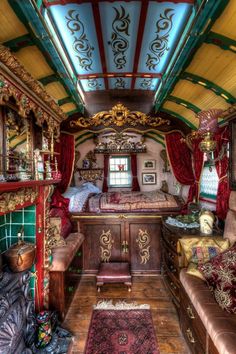 the interior of an old train car with furniture and decor