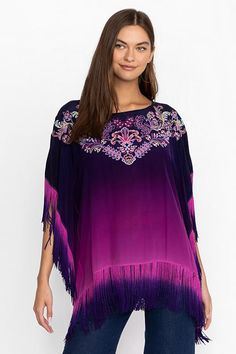 Beautifully adorned with intricate placement embroidery, the Alani Ombre Poncho is washed in a vibrant shade of violet. Crafted from 100% silk and featuring a rounded collar and a dropped shoulder line, this poncho is finished with delicate fringe at the hemlines. Pair with fitted jeans and trendy ankle boots for a night out with friends. Johnny Was Women's Alani Ombre Poncho in Violet Indigo Purple, Size Large/XL, 100% Silk Placement Embroidery, Indigo Purple, Fitted Jeans, Shades Of Violet, Boho Tees, Boho Chic Outfits, Boho Tunics, Embroidered Jeans, Peasant Tops