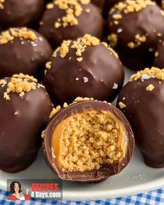 chocolate covered candies on a plate with crumbs in the middle and caramel topping