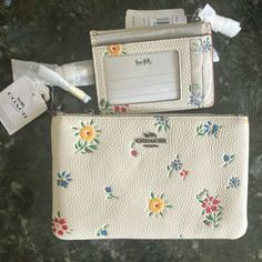 New Items With Tags. Small Set. Consist Only Of The Two Items Wildflower Wristlet With Wrist Strap And Matching Small Id Coin Purse With Credit Card Slots And Zipper Area. Selling Is A Two-Piece Set Only. Coach Pouch Wallet For Spring, White Wallet For Everyday Use In Spring, Coach Spring Pouch Wallet, White Wallets For Everyday Use In Spring, White Wallet For Everyday Use, White Wallets For Spring Gift, White Wallets For Spring, White Everyday Wallets For Spring, Coach White Pouch Wallet