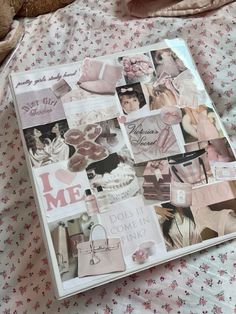 an open book on a bed covered in pink and white pictures, with a teddy bear laying next to it