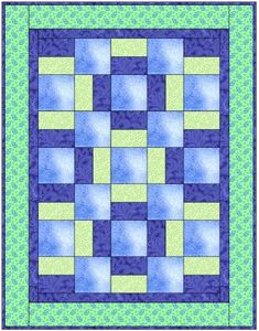 a blue and green quilt with squares in the center, on top of it is a square