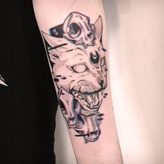 a cat tattoo on the right arm and shoulder, with an animal's face