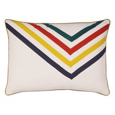 a white pillow with multicolored chevrons on the front and back side