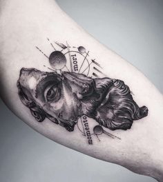 a black and white photo of a dog's head on the right arm with planets around it