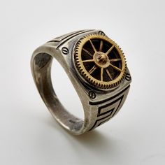 Sterling Silver signet ring set and soldered with double layered brass clock gear. Unisex. More Steampunk Jewelry : https://www.etsy.com/shop/galbarash?search_query=steampunk Back to my shop :  www.etsy.com/shop/galbarash More Signet rings :  www.etsy.com/shop/galbarash?ref=hdr_shop_menu&search_query=Signet More rings :  www.etsy.com/shop/galbarash?section_id=6176173 Handmade Made with nuts from the jewelry design studio of Gal Barash. All items are delivered in a special gift box. Silver & Brass Finish: Most of the jewelry and in particular the rings, which are worn exposed to the elements as they accompany you in life, will result in a unique individual color and surface finish. This depends on your habits and your skin and body acidity, so any finish you order: shiny clean or oxidized b Silver Bra, Gear Ring, Cool Rings For Men, Clock Gears, Steampunk Rings, Jewelry Design Studio, Metalwork Jewelry, Signet Rings, Silver Signet Ring