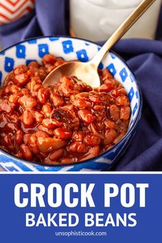 crock pot baked beans in a blue and white bowl with a spoon on top