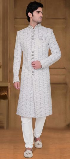 Luxury White Sherwani For Puja, Luxury White Sherwani With Self Design, Luxury Off-white Traditional Sherwani, White Anarkali Kurta With Naqshi Details, White Anarkali Kurta With Naqshi, White Anarkali Sherwani For Reception, White Nehru Jacket With Dabka Embroidery, White Bandhgala With Traditional Dabka Drape, White Fitted Nehru Jacket With Zari Work