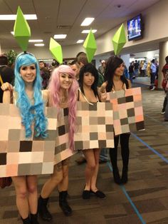 some people are dressed up in costumes and holding signs that say no to minecraft