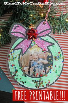 an ornament hanging from a christmas tree with the words free printable on it