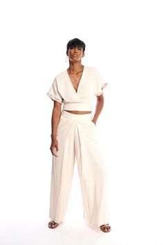 Relaxed fit Pleated palazzo pants 100% Cupro Care: - Dry Clean ,Hand wash or delicate machine wash warm - Dry flat - Dry Iron on wrong side with low heat xs 0-2, small 2-4, med 6-8, large 10-12, xl 12-14 Sesillee is 5'10" size 4/6 wearing a small MADE IN NYC Spring Accordion Pleated Pants, Spring Pants With Pleated Waist And Relaxed Fit, Spring Trousers With Accordion Pleats, Beige Bottoms With Accordion Pleats For Spring, Beige Accordion Pleated Bottoms For Spring, Pleated Palazzo Pants, Cupro Fabric, Wrap Pants, Palazzo Pant