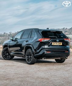 the rear end of a black toyota suv