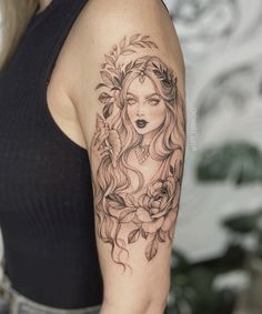 a woman with long hair and flowers on her arm