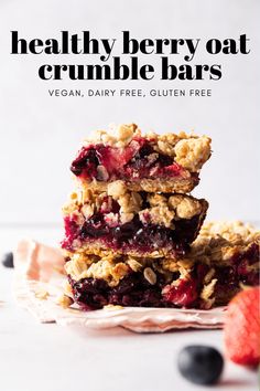 healthy berry oat crumble bars stacked on top of each other