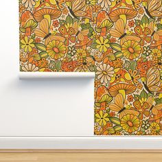 an orange and yellow wallpaper with flowers on it